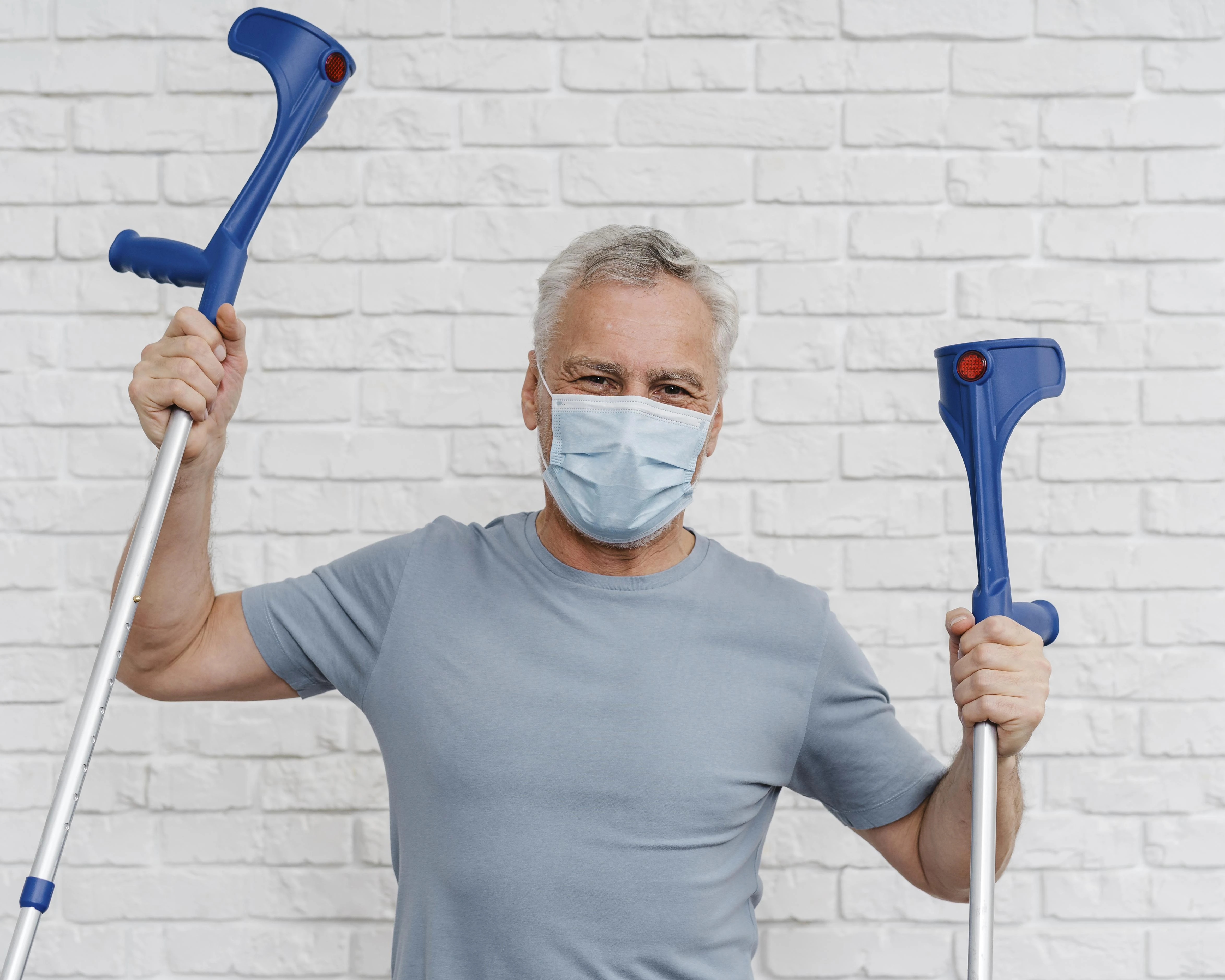 Adult Male Posing With His Crutches